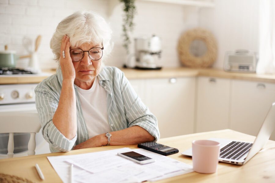 Retired woman reading about social security