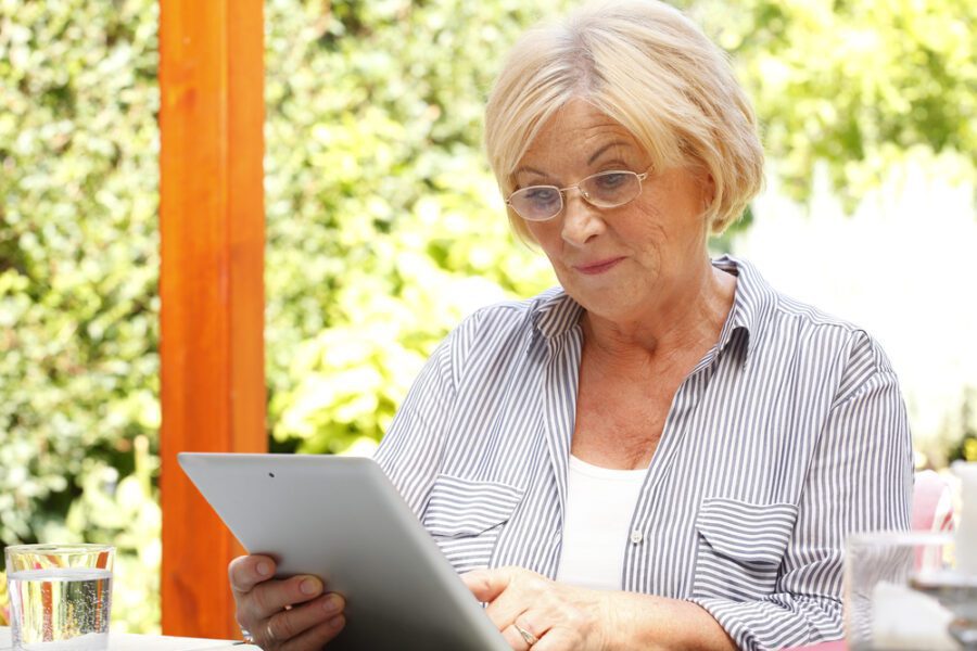 Retired woman reading money